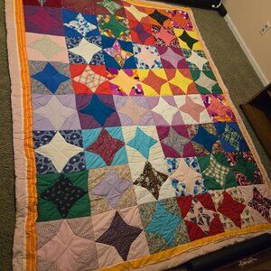 It's a handmade quilt It's 5 foot 10 inches wide and 7 foot and 7 inches long